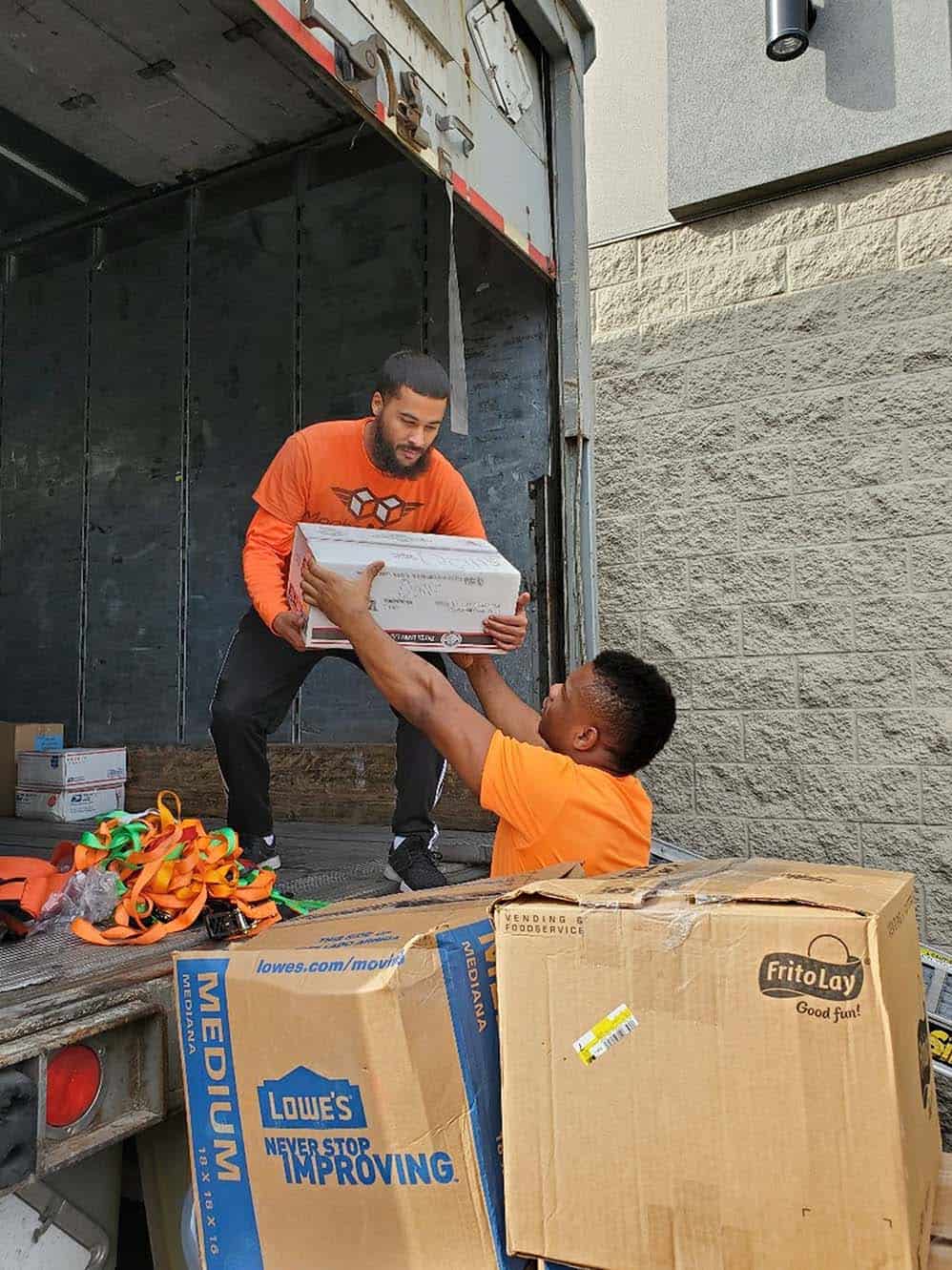 MechaMovers movers carrying boxes